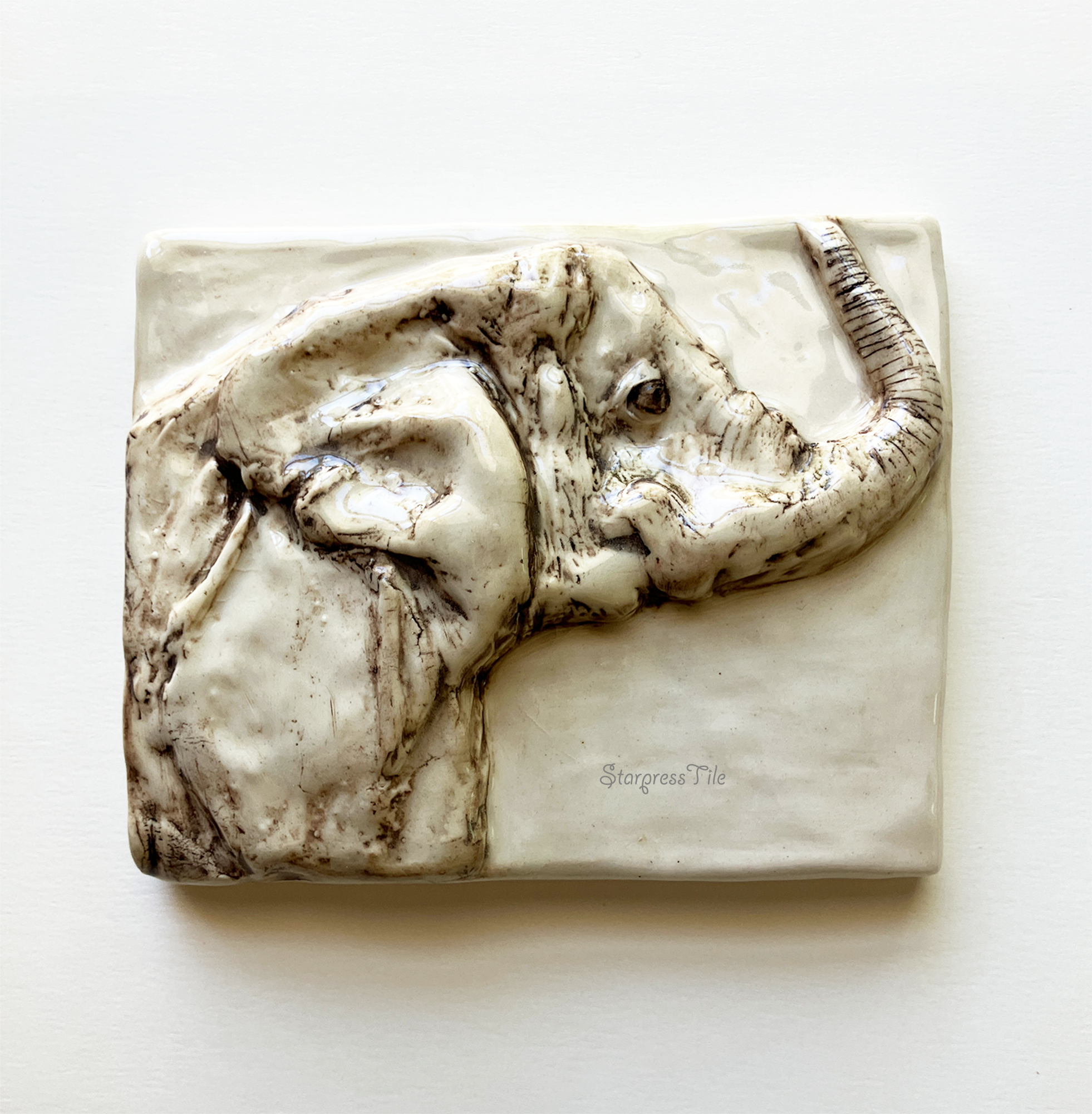 Relief elephant ceramic art tile with brown highlight